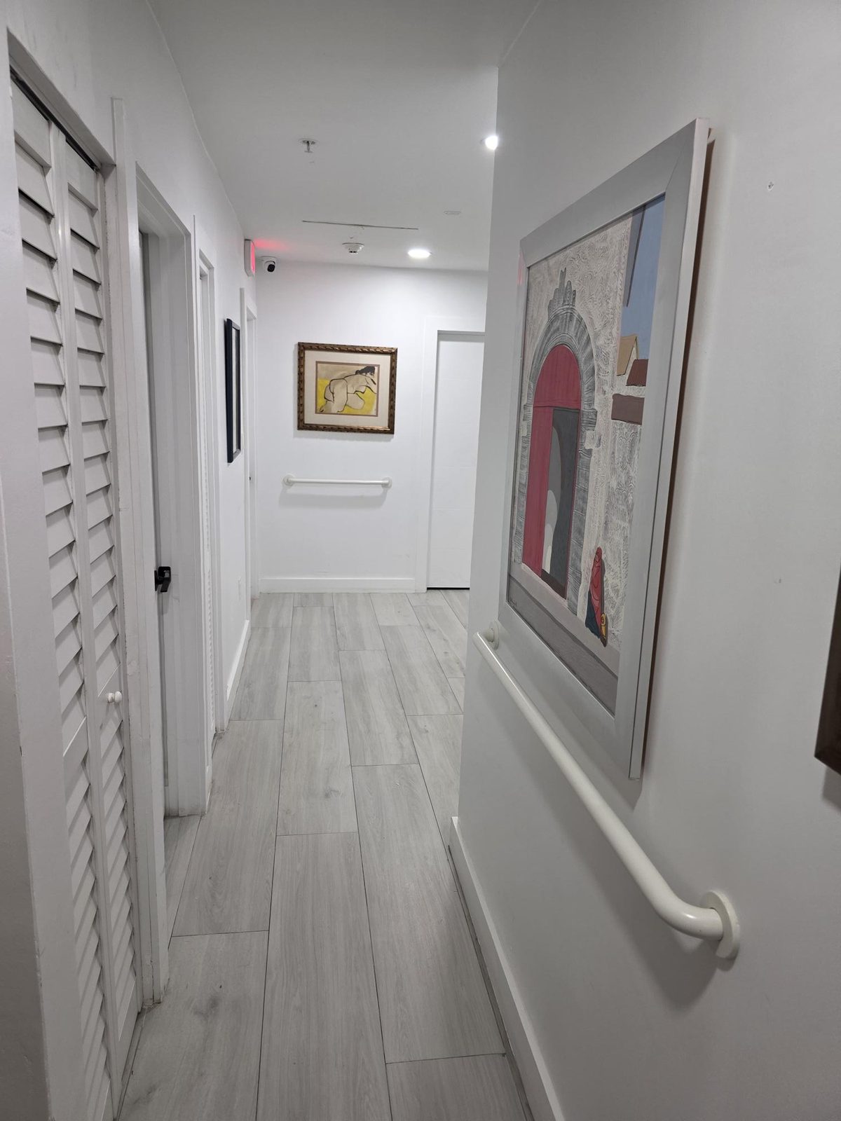 Hallway with handrails at Mary's House ALF in Palmetto Bay