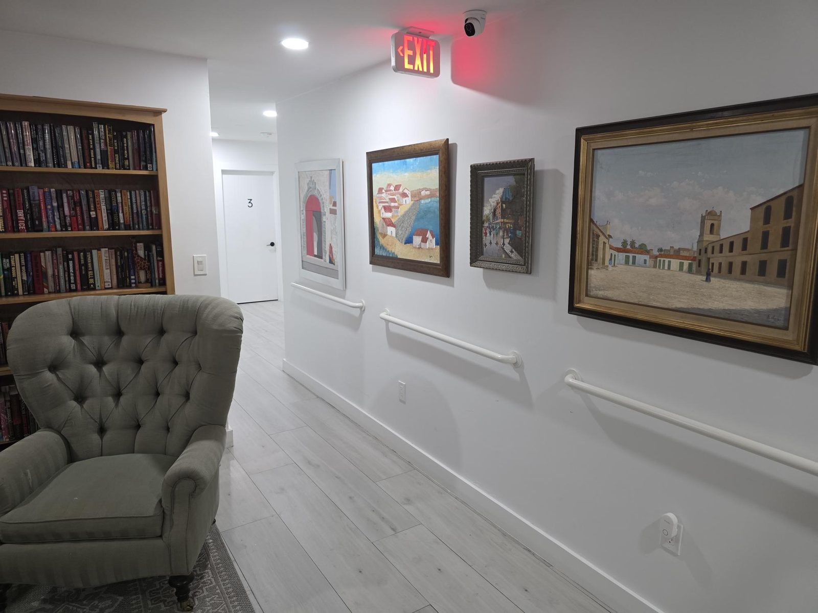 Hallway sitting area with artwork at Mary's House ALF in Palmetto Bay